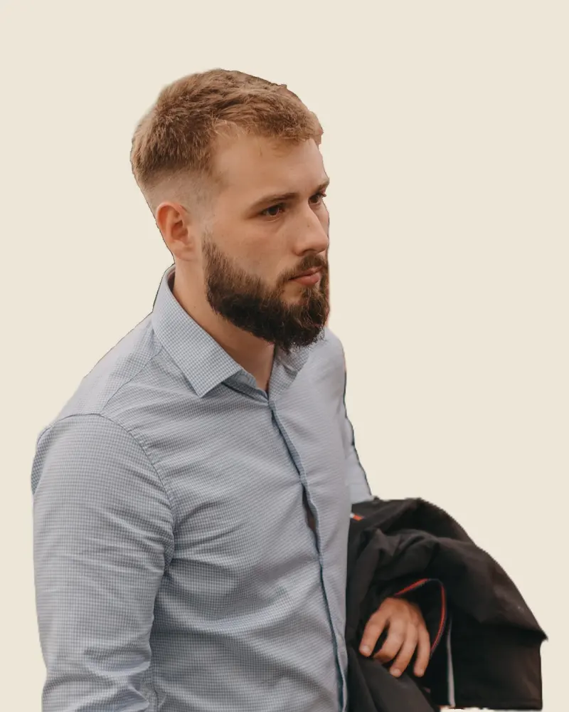 Bruno Molan, founder of Tour to Aisle, in a light shirt with a jacket over his arm